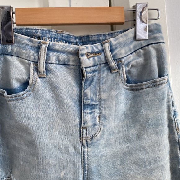 Light Wash Jeans with holes that have fabric underneath - Picture 3 of 5